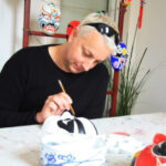 A student learns about traditional Chinese art