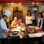 A group of eager diners await some traditional Chinese cuisine