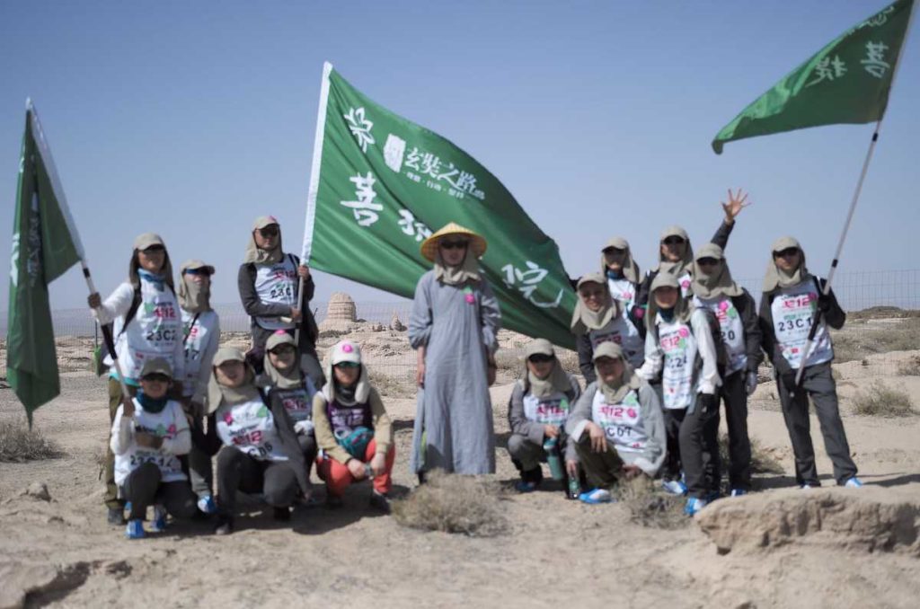 Frankie Lowe with friends in the Gobi Desert, which is the fifth-largest in the world. It covers northern China and southern Mongolia and is the largest desert in Asia. Vegetation is sparse, and the landscape ranges from rocky mountains to flat, arid deserts.